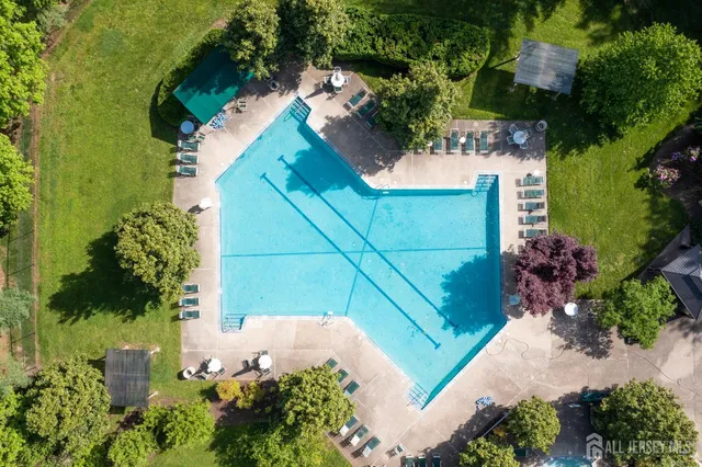 an aerial view of a house with a big yard