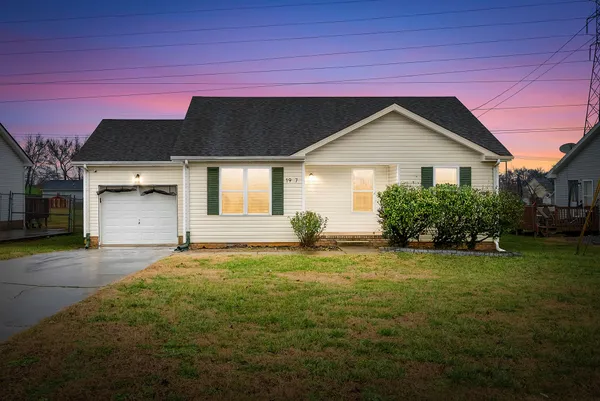 a house with trees in the background