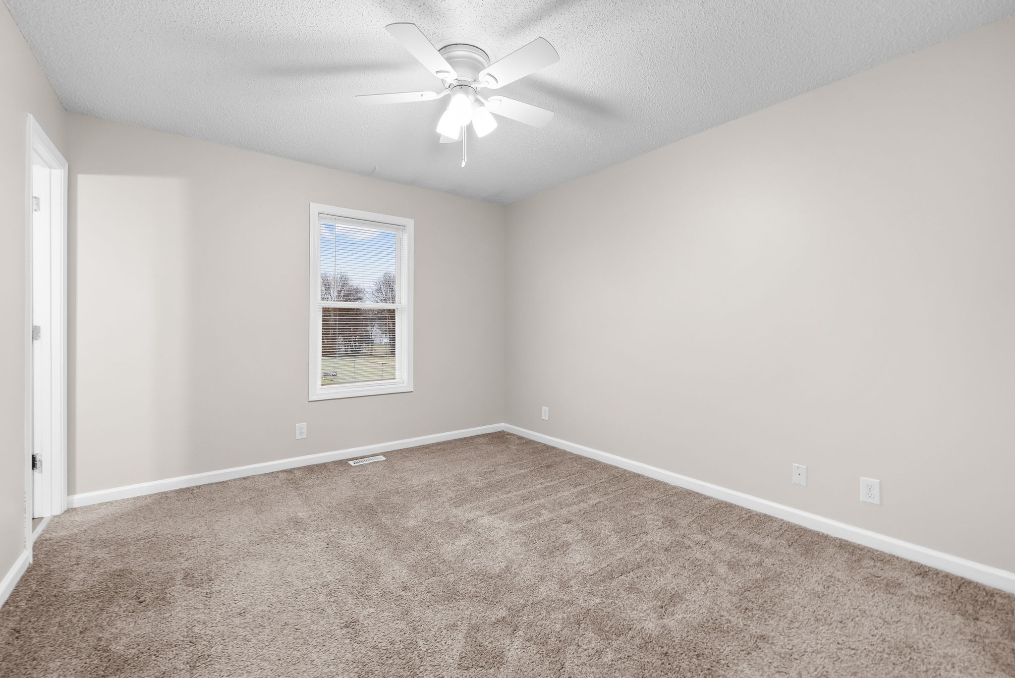 1957 Timberline Circle Oak Grove, KY 42262 - Photo 14 of 29 an empty room with windows and fan