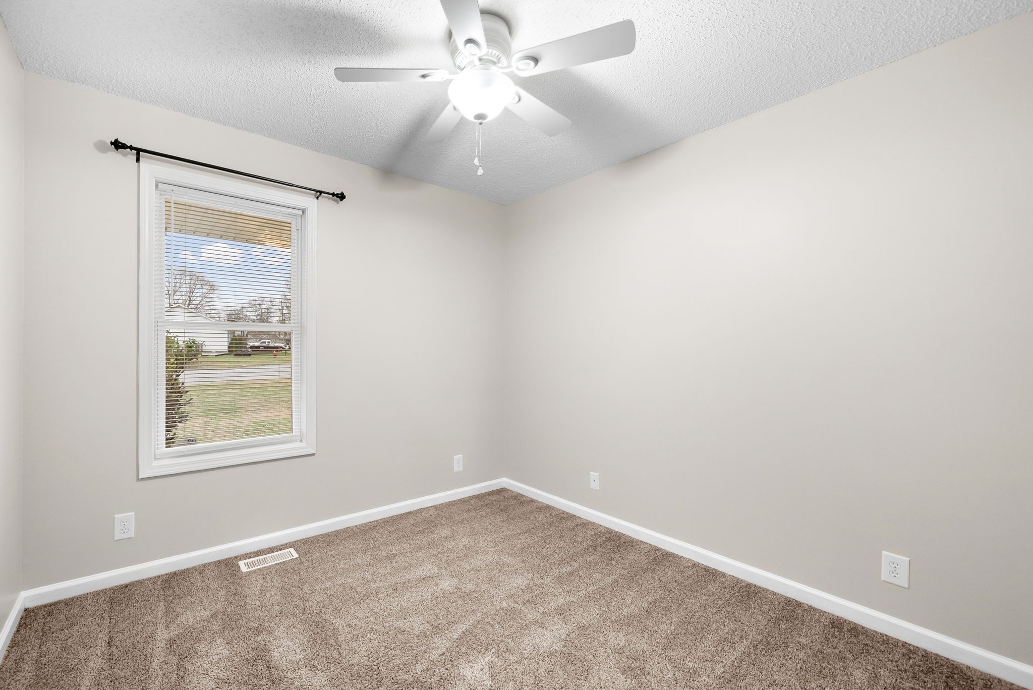 1957 Timberline Circle Oak Grove, KY 42262 - Photo 19 of 29 an empty room with windows and fan