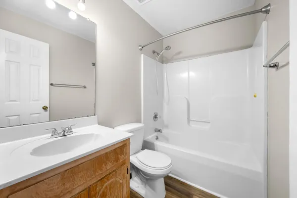 a bathroom with a sink toilet tub and shower