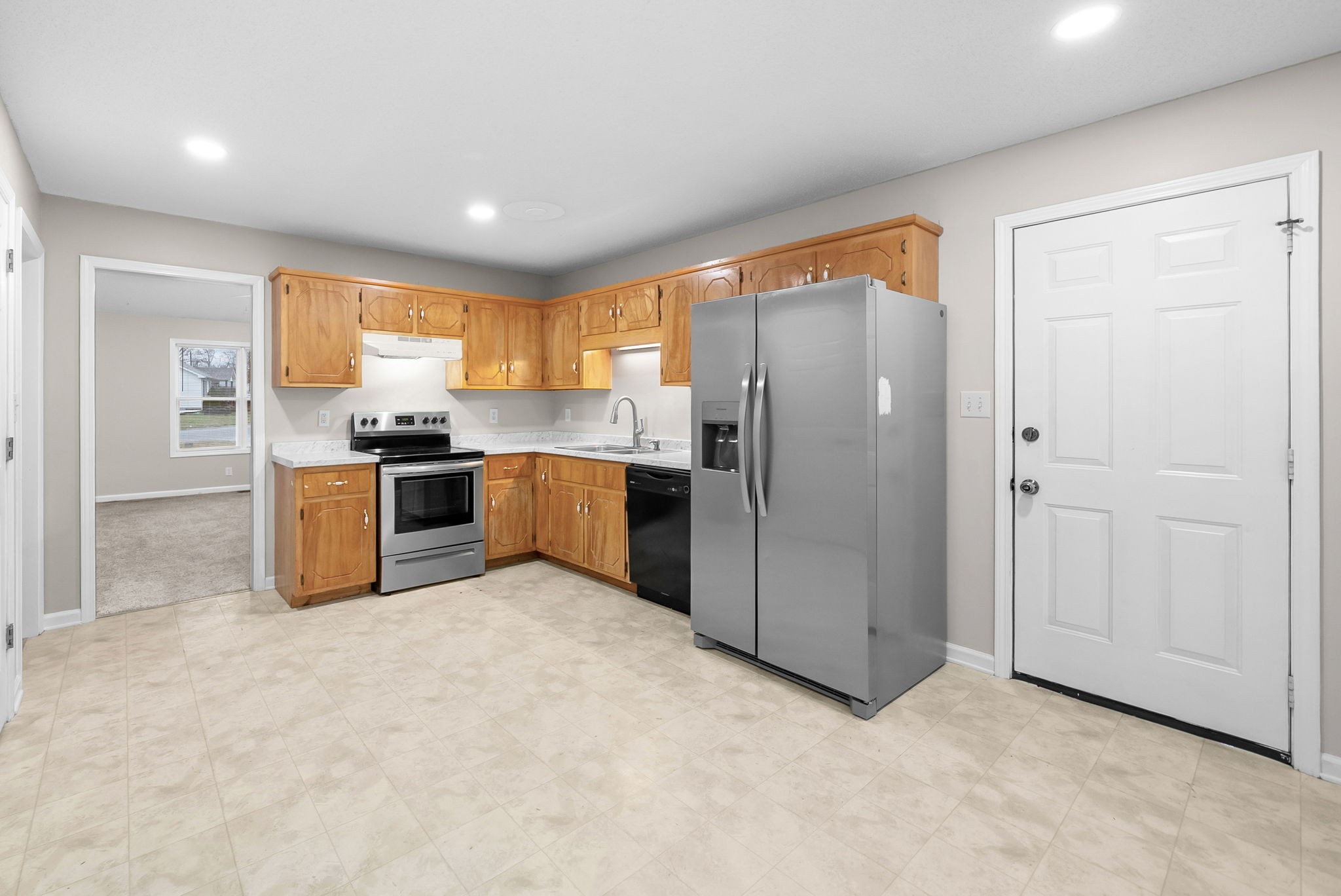 1957 Timberline Circle Oak Grove, KY 42262 - Photo 10 of 29 a kitchen with stainless steel appliances granite countertop a refrigerator and a stove top oven