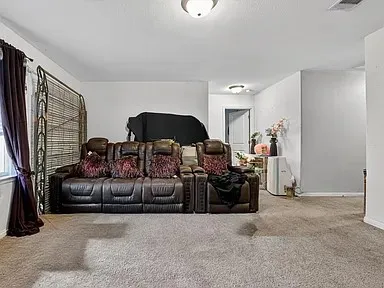 a living room with furniture and a couch