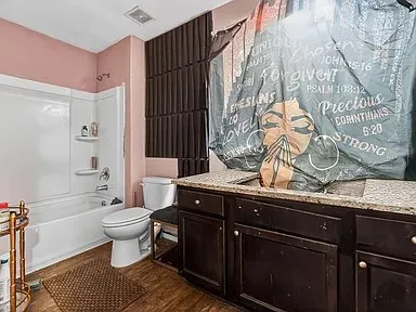 a bath room with a sink and a toilet