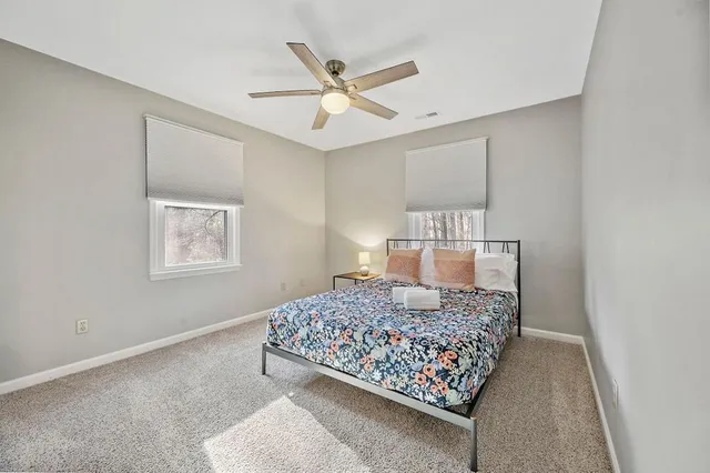 a bedroom with a bed and window