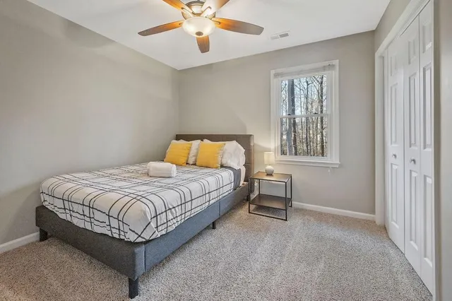 a bedroom with a bed and window