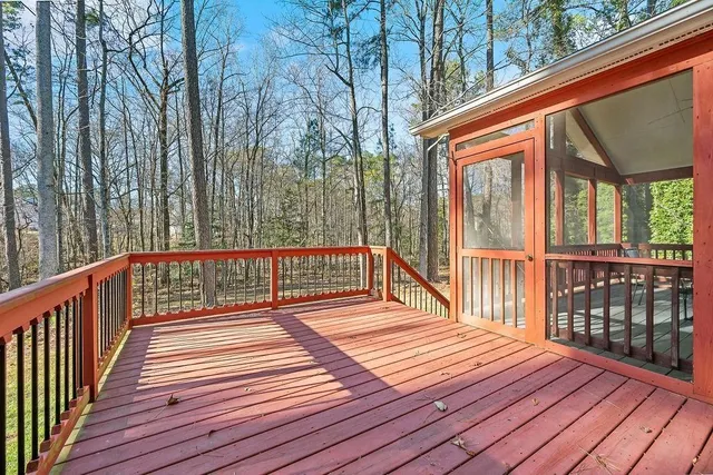a balcony with wooden floor