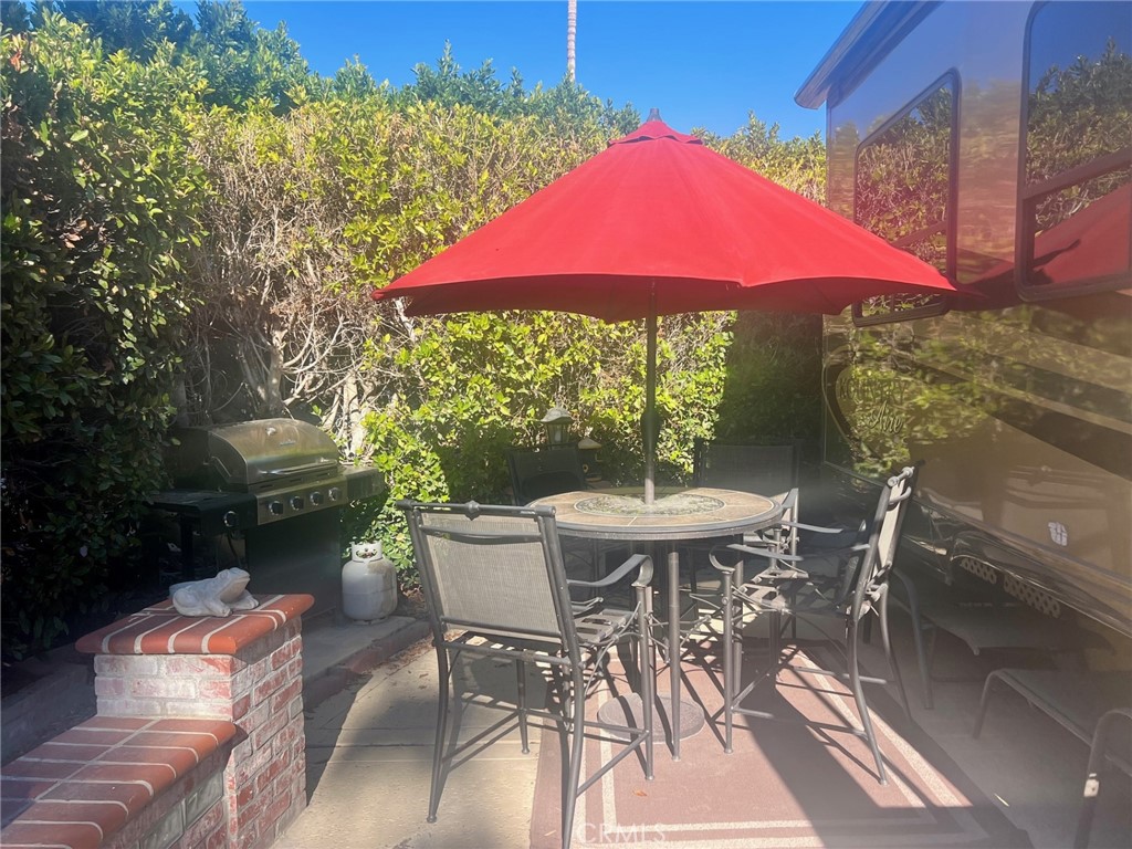 69411 Ramon Road, Unit 360 Cathedral City, CA 92234 - Photo 12 of 23 a view of a patio with furniture and a yard
