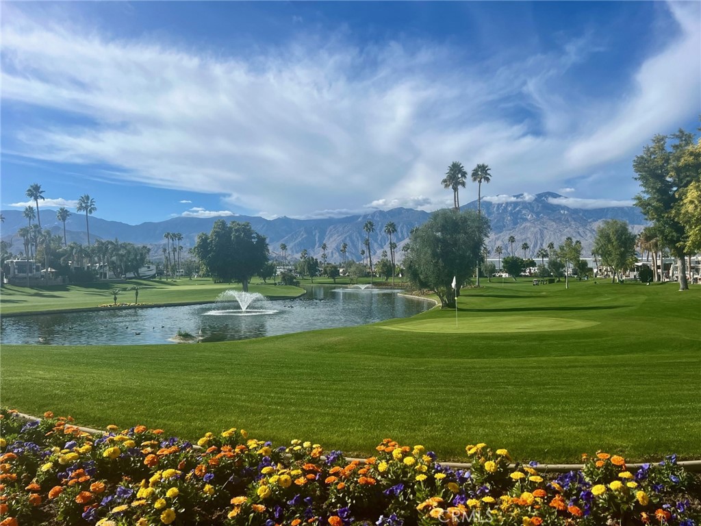 69411 Ramon Road, Unit 360 Cathedral City, CA 92234 - Photo 14 of 23 a view of a golf course with a lake