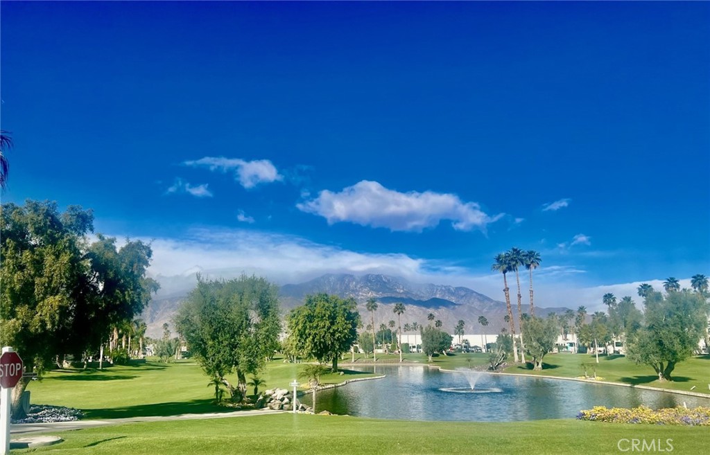 69411 Ramon Road, Unit 360 Cathedral City, CA 92234 - Photo 21 of 23 a view of a lake with a big yard
