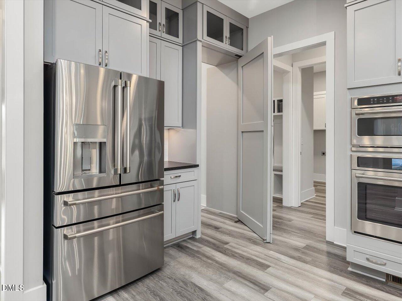 5212 Purnell Road Wake Forest, NC 27587 - Photo 10 of 36 a kitchen with stainless steel appliances and refrigerator