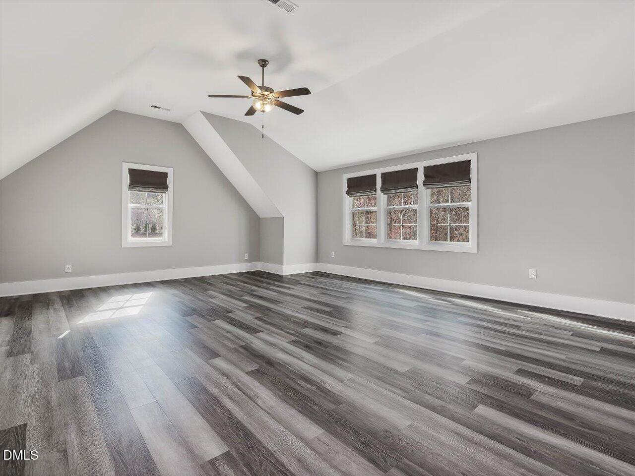 5212 Purnell Road Wake Forest, NC 27587 - Photo 29 of 36 a view of empty room with wooden floor and fan