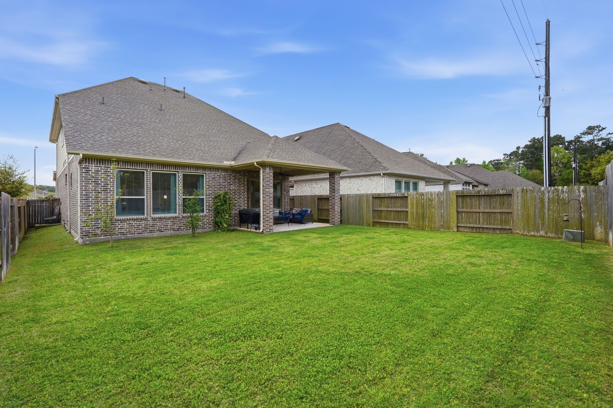 24423 Morningside Terrace Tomball, TX 77375 - Photo 27 of 47 a front view of a house with a garden and porch