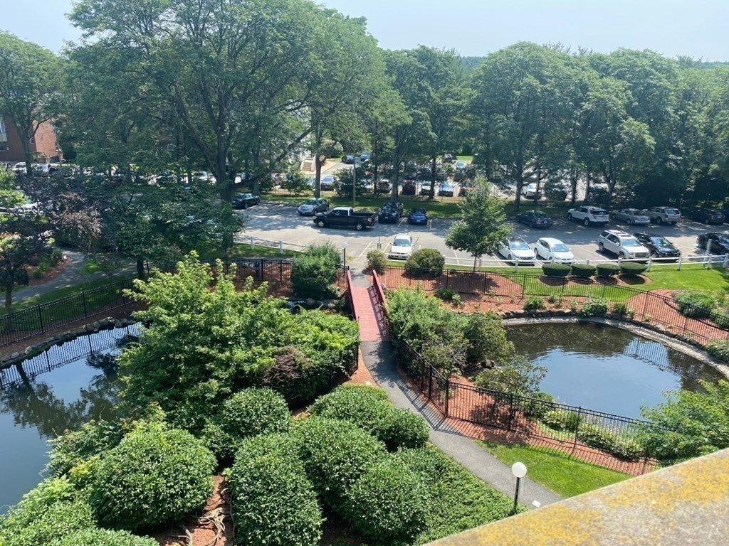 200 Swanton Street, Unit 237 Winchester, MA 01890 - Photo 14 of 14 a view of a lake with a house