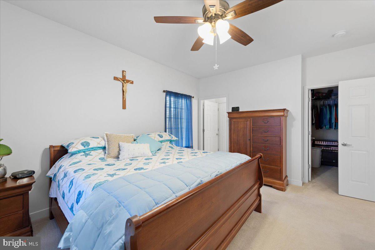 30611 Cedar Neck Road, Unit 2201 Ocean View, DE 19970 - Photo 27 of 60 Primary bedroom with primary walk-in closet