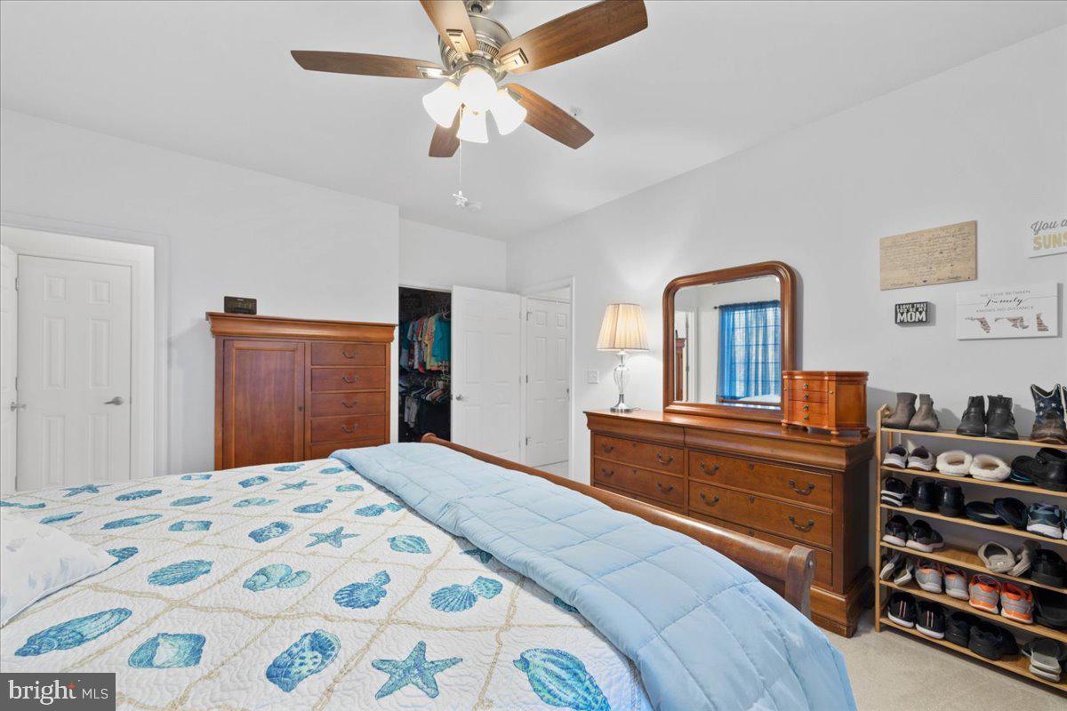 30611 Cedar Neck Road, Unit 2201 Ocean View, DE 19970 - Photo 28 of 60 Primary bedroom with primary walk-in closet