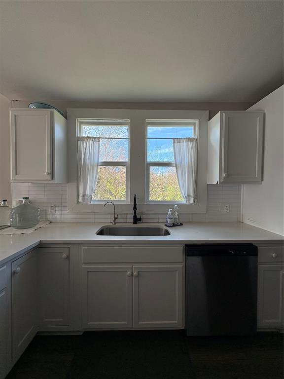 827 West Ellis Street Sherman, TX 75092 - Photo 3 of 9 a kitchen with a sink stove and cabinets