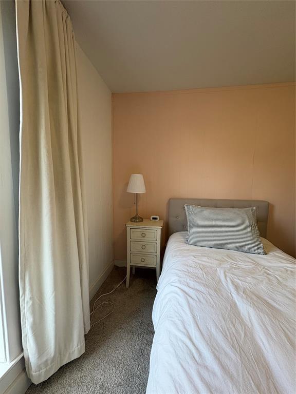 827 West Ellis Street Sherman, TX 75092 - Photo 8 of 9 a bedroom with a bed and a window