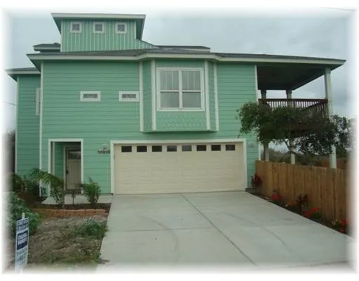 a front view of a house with garage