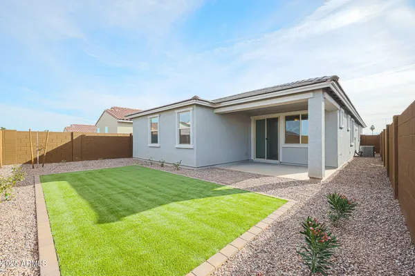 a view of a house with a yard and garage