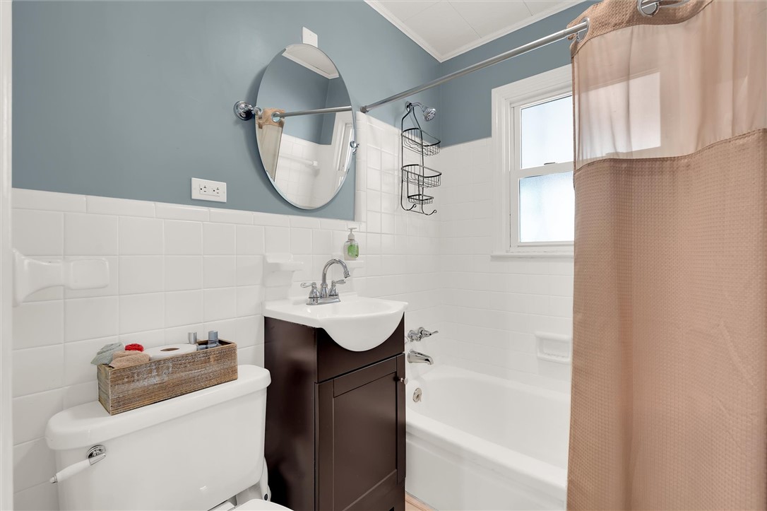 503 Stone Drive Anderson, SC 29625 - Photo 20 of 25 This bright bathroom features crisp white tile and a functional, modern design.