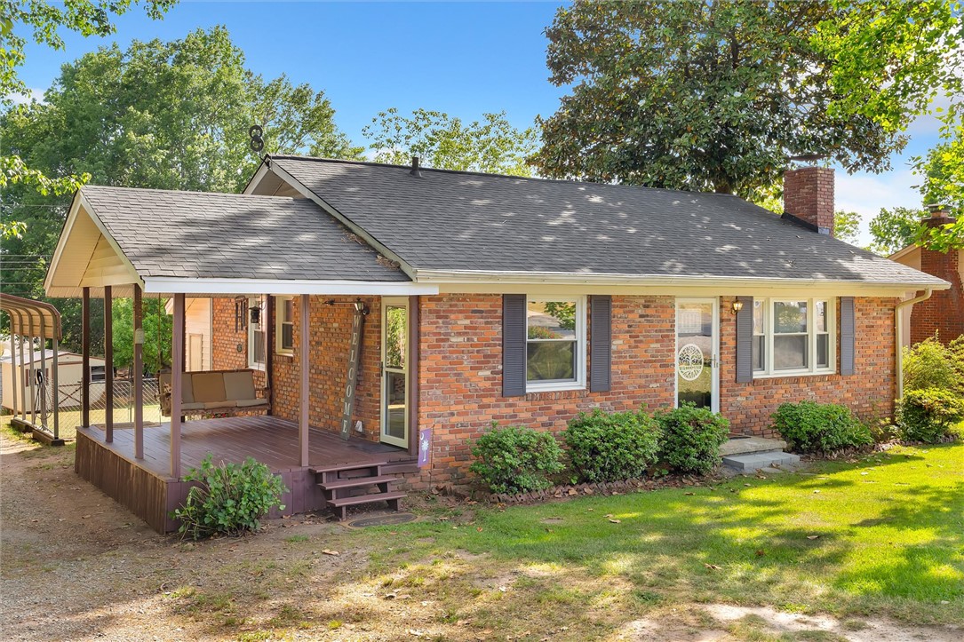 503 Stone Drive Anderson, SC 29625 - Photo 2 of 25 This charming brick home offers inviting curb appeal and a spacious covered porch, ideal for outdoor relaxation.