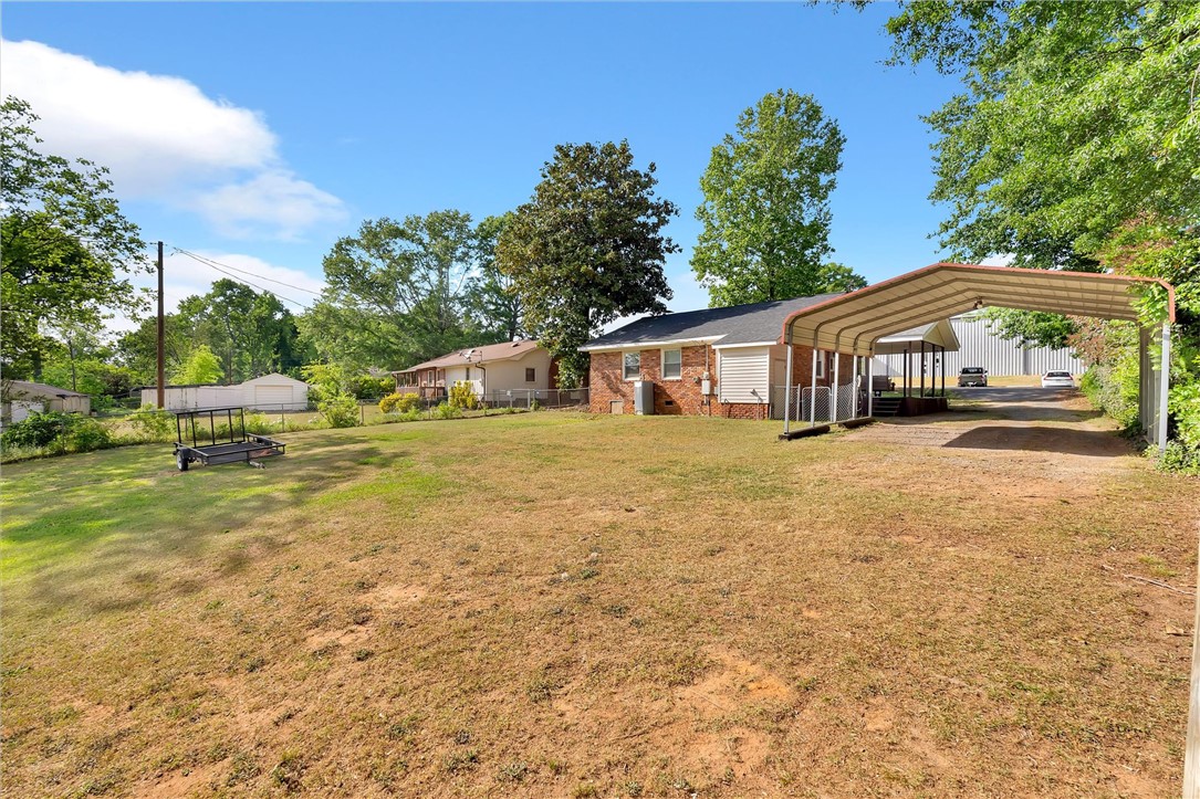 503 Stone Drive Anderson, SC 29625 - Photo 23 of 25 Expansive backyard with a covered carport offers ample outdoor living potential.