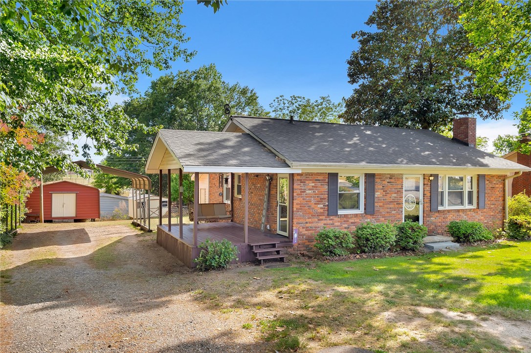 503 Stone Drive Anderson, SC 29625 - Photo 3 of 25 This charming brick home features a welcoming covered porch, mature trees, and a spacious yard.
