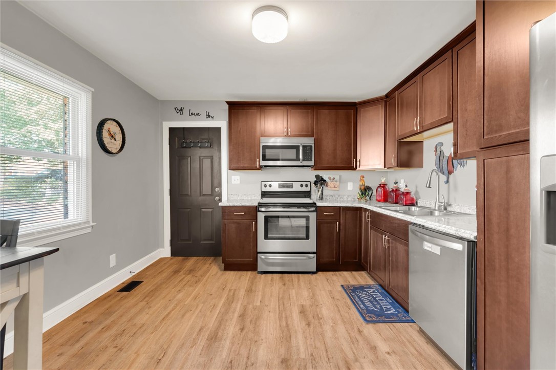 503 Stone Drive Anderson, SC 29625 - Photo 10 of 25 This spacious kitchen offers a functional layout, abundant cabinetry, and durable flooring for daily living.