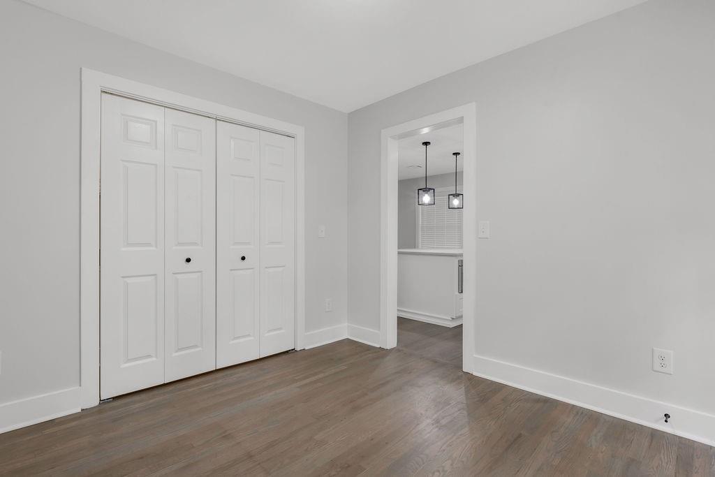 2219 Sharon Way Decatur, GA 30032 - Photo 11 of 23 a view of an empty room with wooden floor