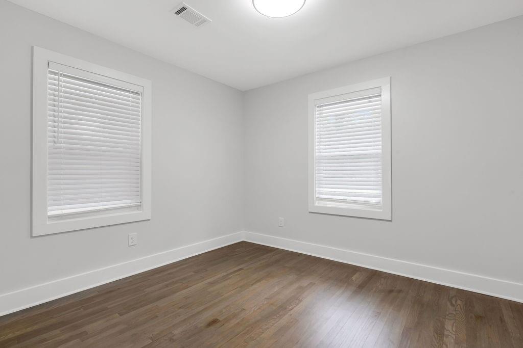 2219 Sharon Way Decatur, GA 30032 - Photo 15 of 23 an empty room with wooden floor and a window