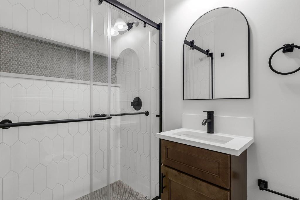 2219 Sharon Way Decatur, GA 30032 - Photo 17 of 23 a bathroom with a sink and mirror