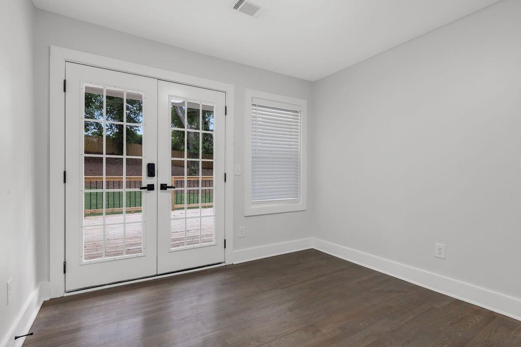 2219 Sharon Way Decatur, GA 30032 - Photo 9 of 23 a view of empty room with wooden floor and fan