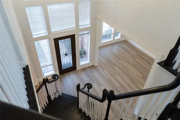 a view of an entryway with wooden floor