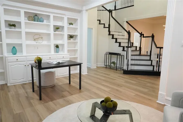 a workspace with furniture hardwood and a wooden floor