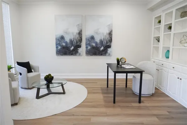 a workspace with furniture and wooden floor