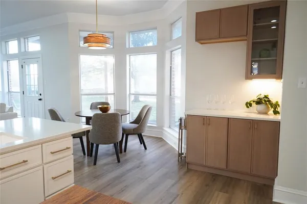 a view of a dining room with furniture and window