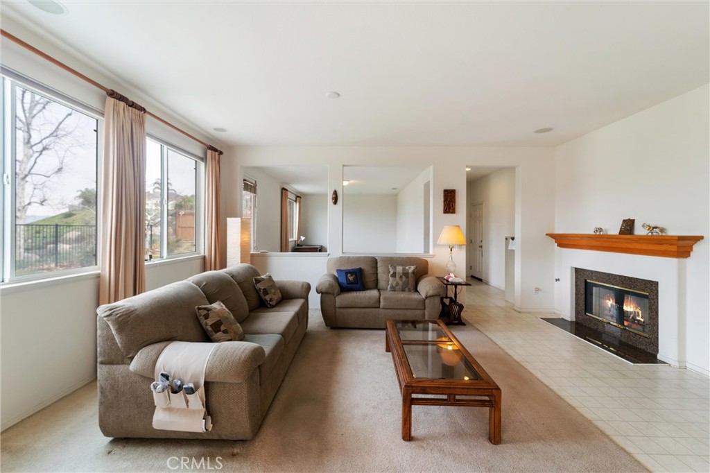 17191 Greentree Drive Riverside, CA 92503 - Photo 12 of 53 a living room with furniture and a fireplace