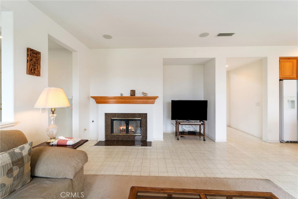 17191 Greentree Drive Riverside, CA 92503 - Photo 16 of 53 a living room with furniture and a fireplace