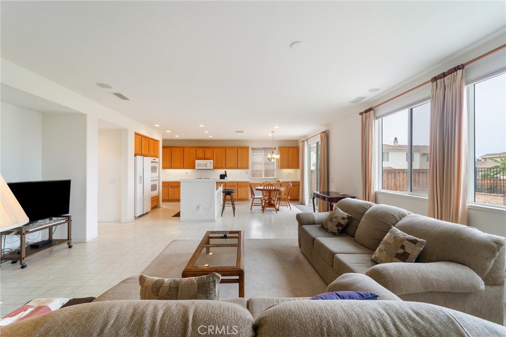 17191 Greentree Drive Riverside, CA 92503 - Photo 19 of 53 a living room with furniture and a flat screen tv