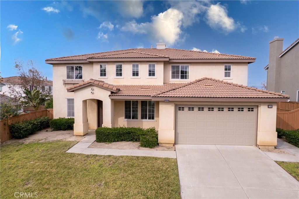 17191 Greentree Drive Riverside, CA 92503 - Photo 2 of 53 a front view of a house with a yard and garage