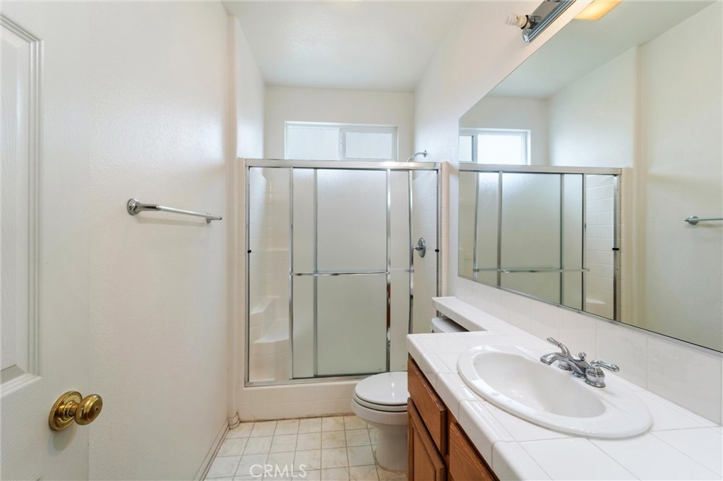 17191 Greentree Drive Riverside, CA 92503 - Photo 21 of 53 a bathroom with a sink and a mirror