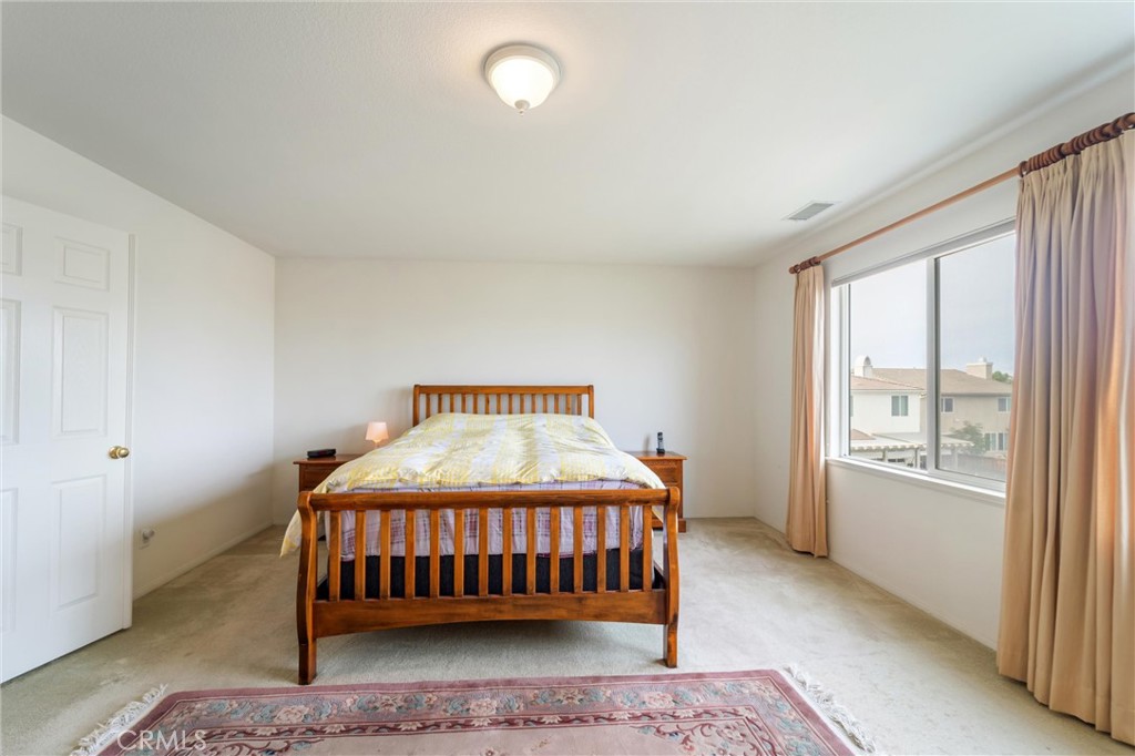 17191 Greentree Drive Riverside, CA 92503 - Photo 26 of 53 a bedroom with a bed and a window