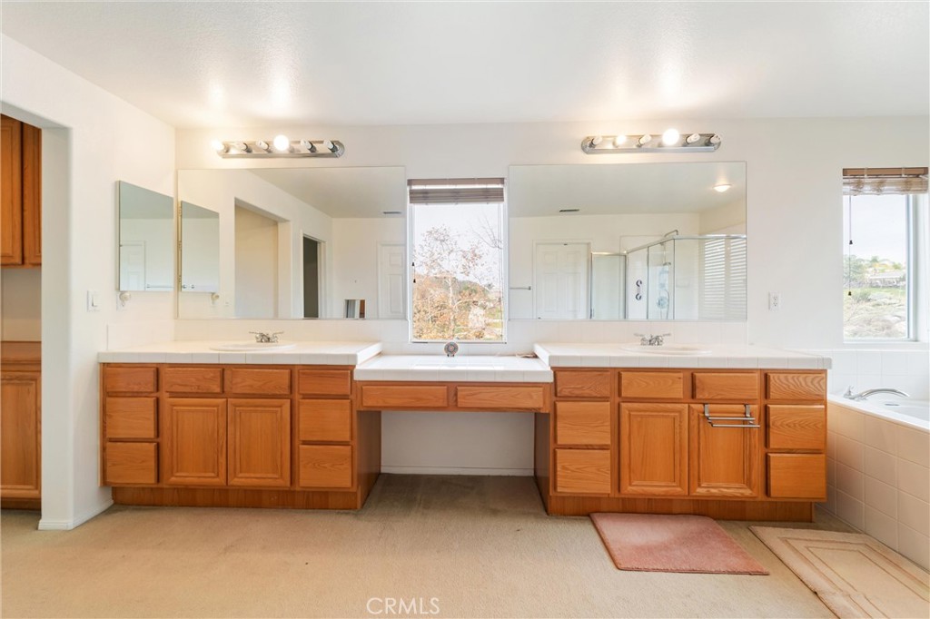 17191 Greentree Drive Riverside, CA 92503 - Photo 29 of 53 a large bathroom with a large tub sink and cabinets