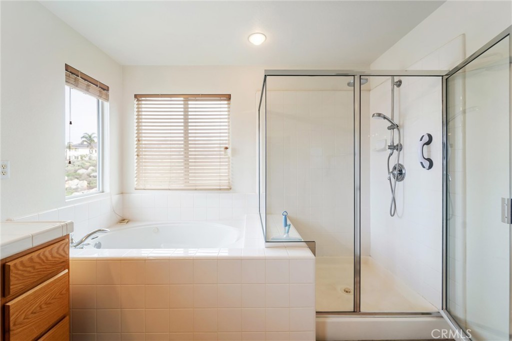 17191 Greentree Drive Riverside, CA 92503 - Photo 30 of 53 a bathroom with a bathtub and a shower