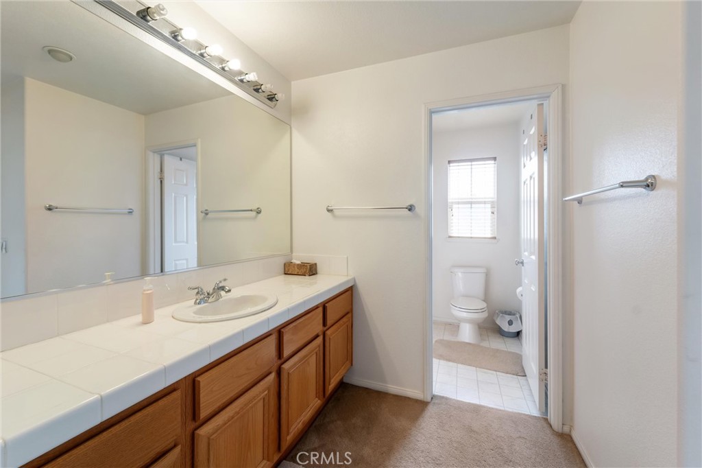17191 Greentree Drive Riverside, CA 92503 - Photo 33 of 53 a bathroom with a sink a toilet and shower