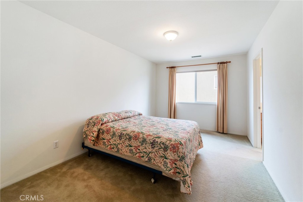17191 Greentree Drive Riverside, CA 92503 - Photo 35 of 53 a bedroom with a bed and a window
