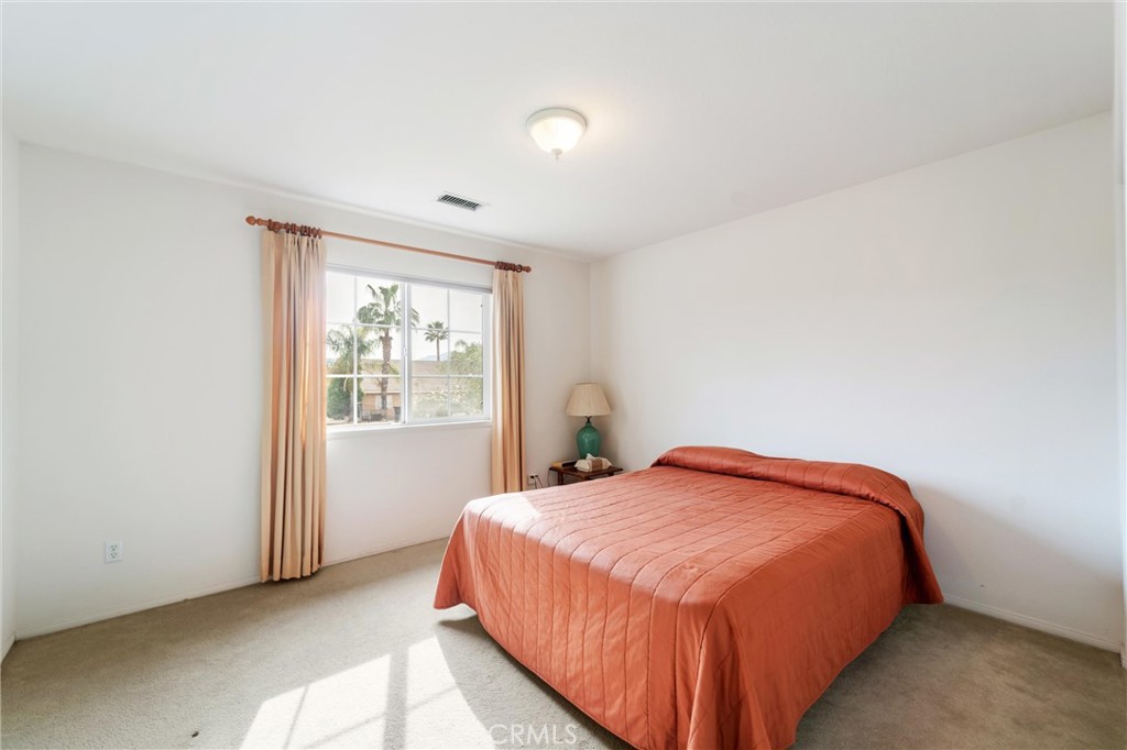17191 Greentree Drive Riverside, CA 92503 - Photo 39 of 53 a bedroom with a bed and window