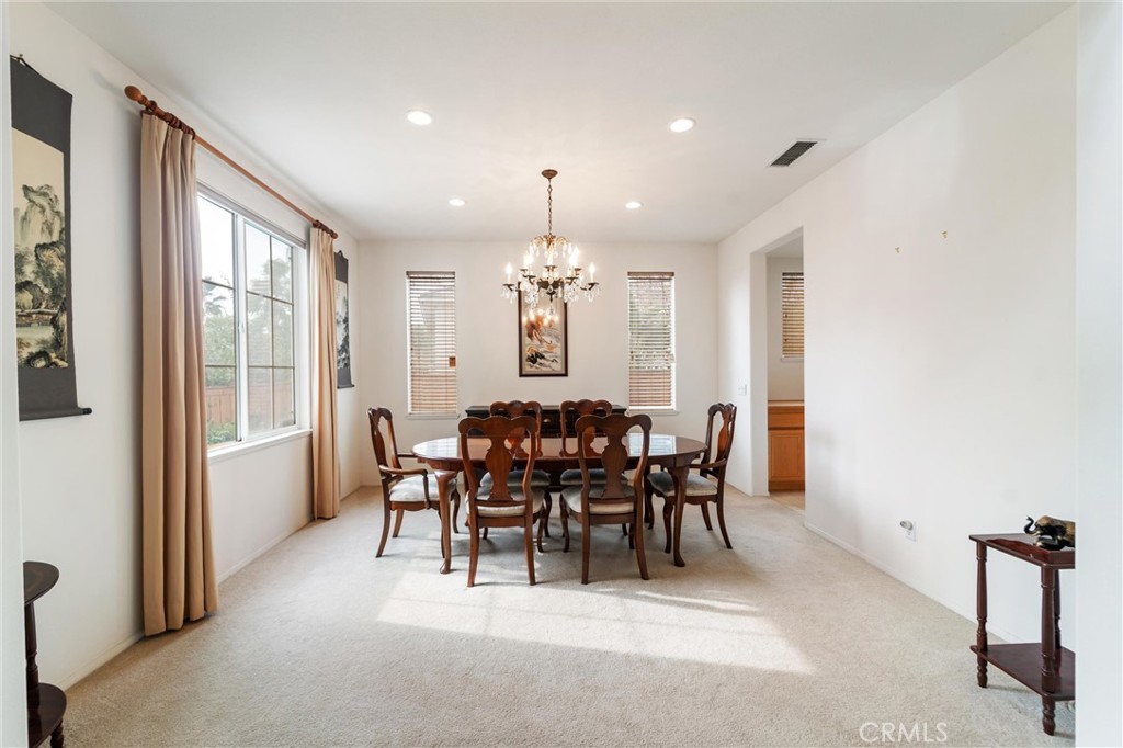 17191 Greentree Drive Riverside, CA 92503 - Photo 5 of 53 a view of a dining room with furniture window and outside view