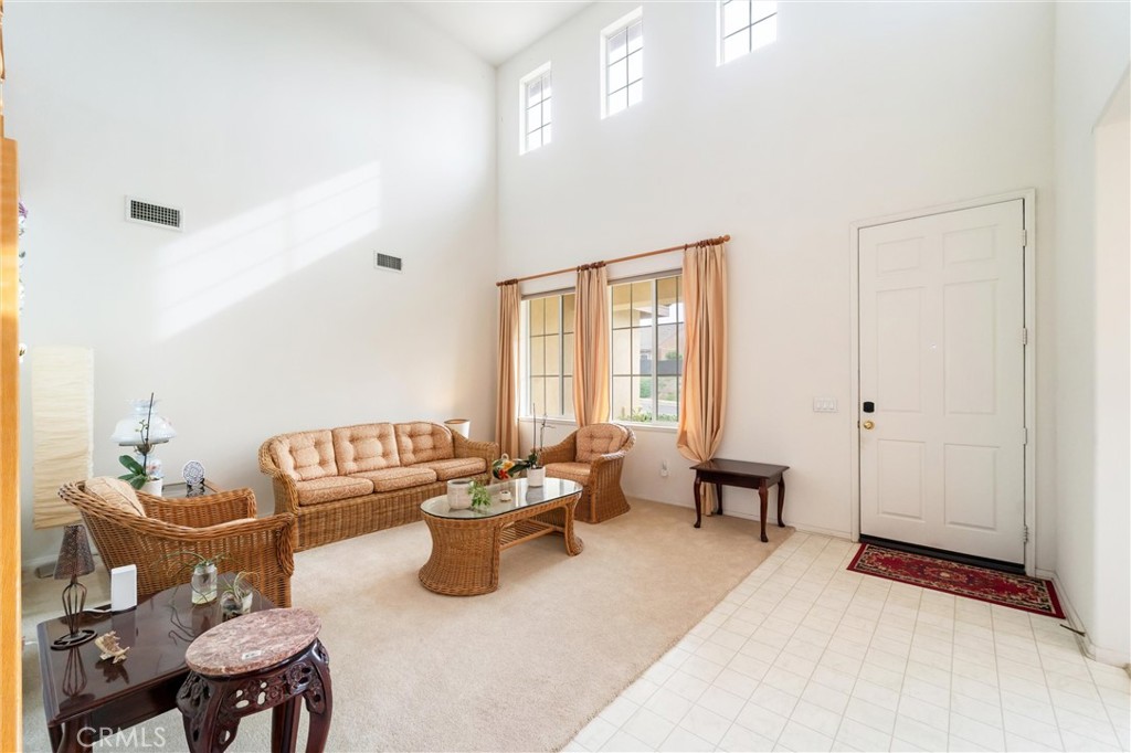 17191 Greentree Drive Riverside, CA 92503 - Photo 7 of 53 a living room with furniture a rug and a window